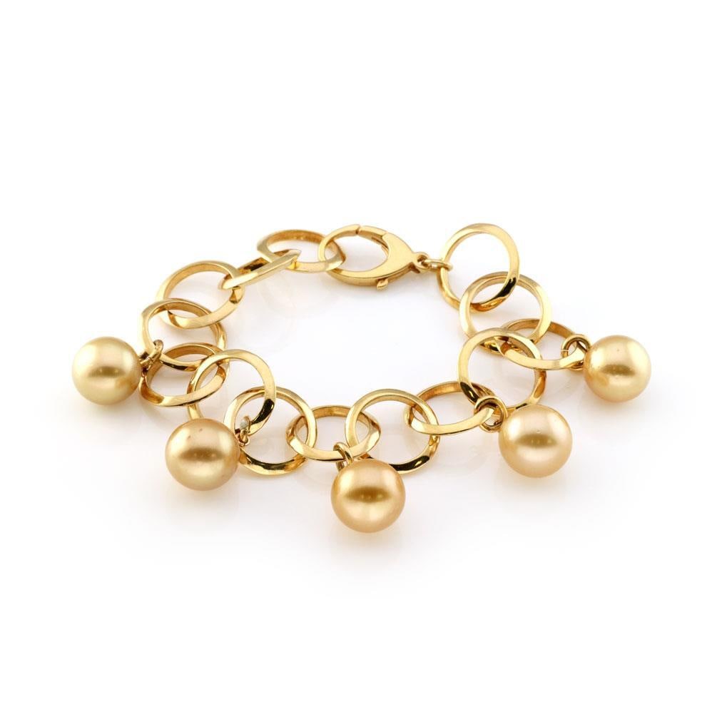 18k Yellow Gold South Sea Pearl Circle Link Bracelet 5 Charms: 18k Yellow Gold South Sea Pearl Circle Link Bracelet 5 Charms This exquisite bracelet features a luxurious design crafted from 18k yellow gold with a polished finish. The bracelet showcases circle lin