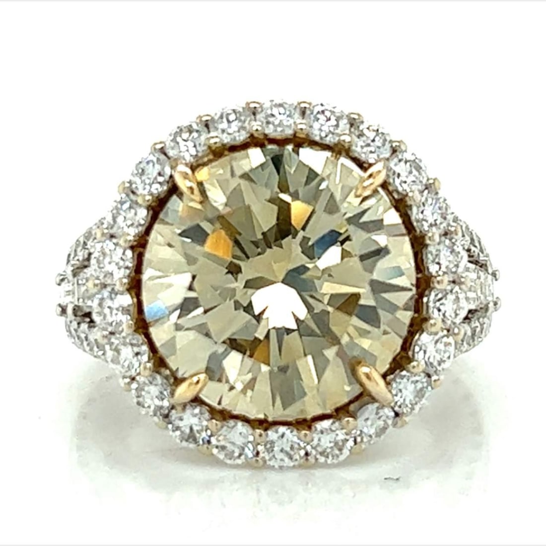 GIA 6.39 Ct Fancy Diamond Ring 18K White Yellow Gold: GIA 6.39 Ct Fancy Diamond Ring 18K White Yellow Gold This stunning ring features a captivating GIA Certified 6.39 Ct. Round Brilliant Diamond, exhibiting a unique Fancy Brownish Greenish Yellow color