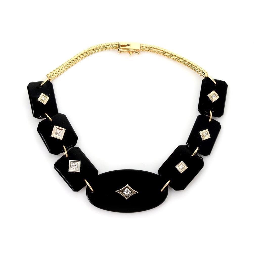 Vintage 14k Two Tone Gold Onyx Diamond Bracelet: Vintage 14k Two Tone Gold Onyx Diamond Bracelet This exquisite vintage bracelet showcases a stunning combination of 14k yellow and white gold. The design features elegant rectangular onyx links, each