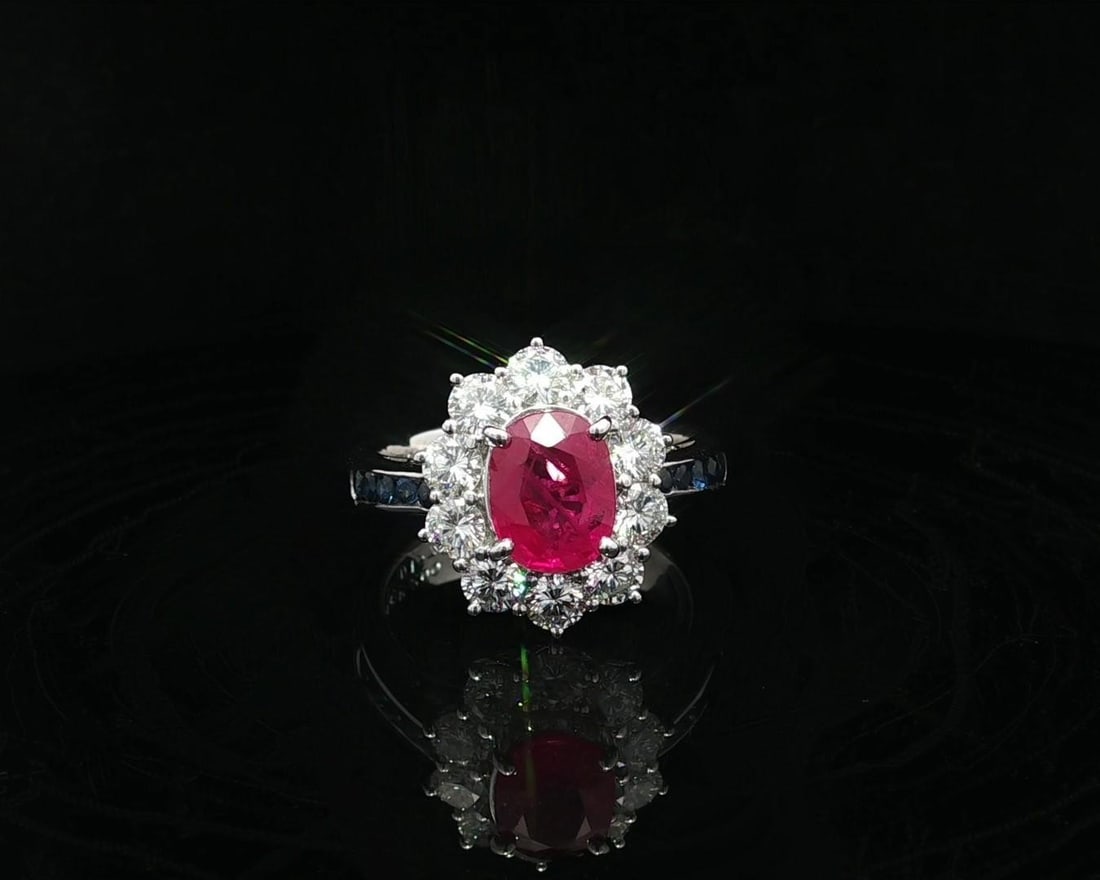 Platinum GIA Certified 3.52ct Burma Ruby Diamond Sapphire Halo Ring: Platinum GIA Certified 3.52ct Burma Ruby Diamond Sapphire Halo Ring This exquisite cocktail ring features a stunning 2.0 carat natural Burmese ruby in a vivid red color, expertly crafted in an oval