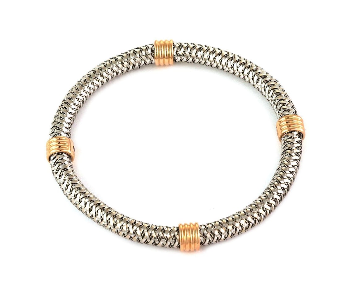 18k Two Tone Gold Basket Weave Flex Bangle by Roberto Coin: 18k Two Tone Gold Basket Weave Flex Bangle by Roberto Coin This Roberto Coin bangle bracelet is crafted from high-quality 18k two-tone gold, featuring both yellow and rose gold in a distinctive
