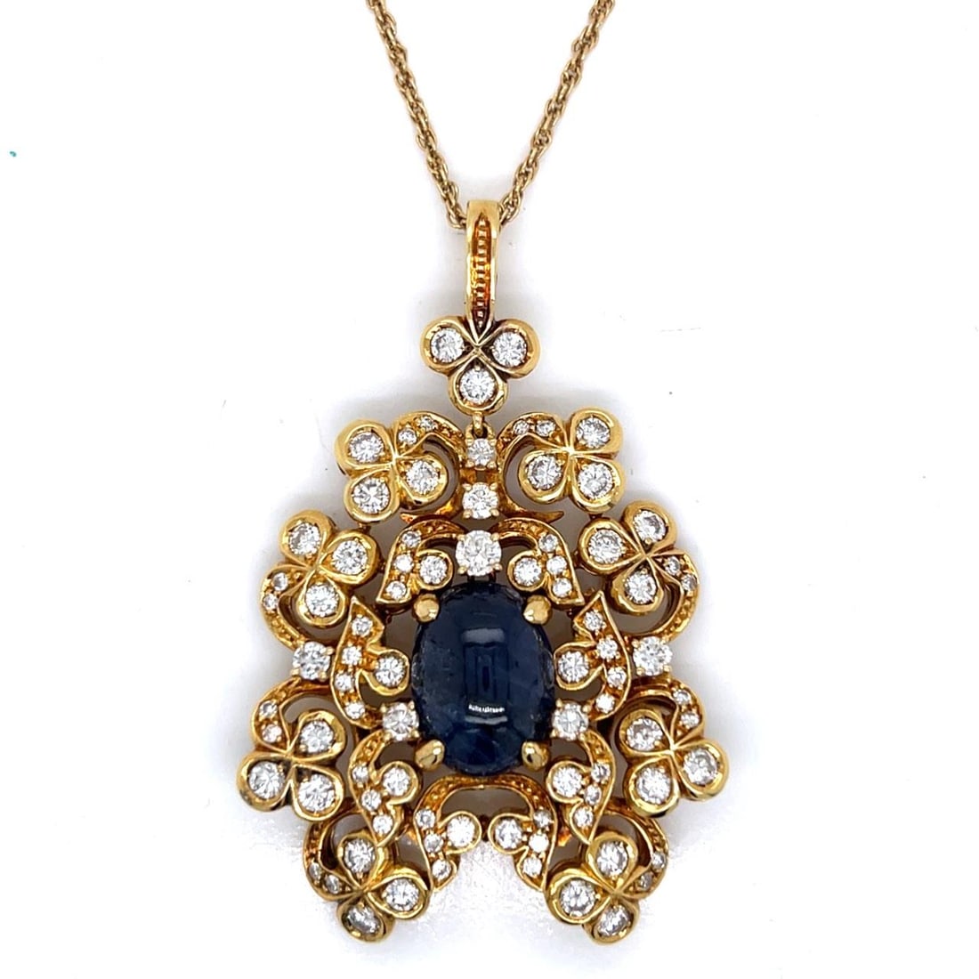 Yellow Gold 18K Necklace with 8 Ct Sapphire and 5.4 Ct Diamonds 16 Inch: Yellow Gold 18K Necklace with 8 Ct Sapphire and 5.4 Ct Diamonds 16 Inch This pre-owned necklace features a striking 8.00 carat sapphire set in 18K yellow gold, adorned with 84 diamonds totaling approx