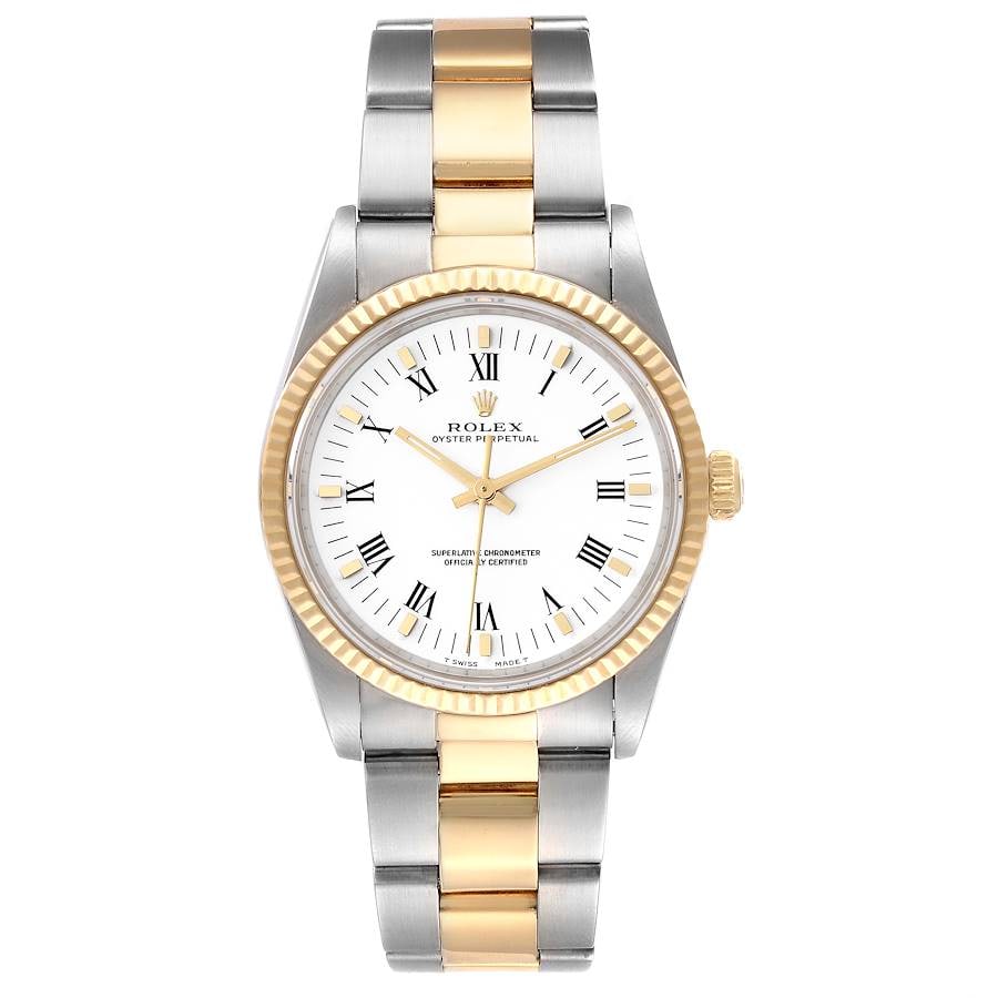 Oyster Perpetual Ref 14233 Unisex Watch White Roman Dial with Papers 1998: Oyster Perpetual Ref 14233 Unisex Watch White Roman Dial with Papers 1998 This Rolex Oyster Perpetual watch features a white Roman numeral dial and a fluted bezel. The timepiece is presented on an