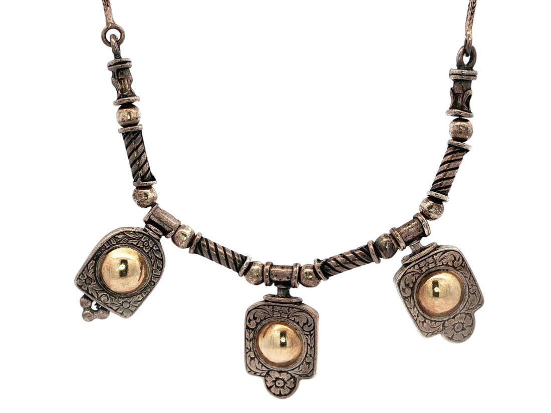 Unbranded Sterling Silver Yellow Gold Filled Floral Dangle Necklace 16.5": Unbranded Sterling Silver Yellow Gold Filled Floral Dangle Necklace 16.5" This elegant necklace features a stunning floral and hand scroll pattern, crafted from sterling silver and yellow gold filled