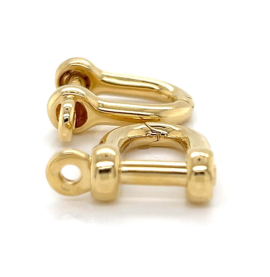 Pair of 14k Yellow Gold Oval Key Bolt Cufflinks with Paper Certificate: Pair of 14k Yellow Gold Oval Key Bolt Cufflinks with Paper Certificate This pair of vintage Van Cleef & Arpels cufflinks is crafted from 14k yellow gold and designed in a key bolt oval shape. The cuff