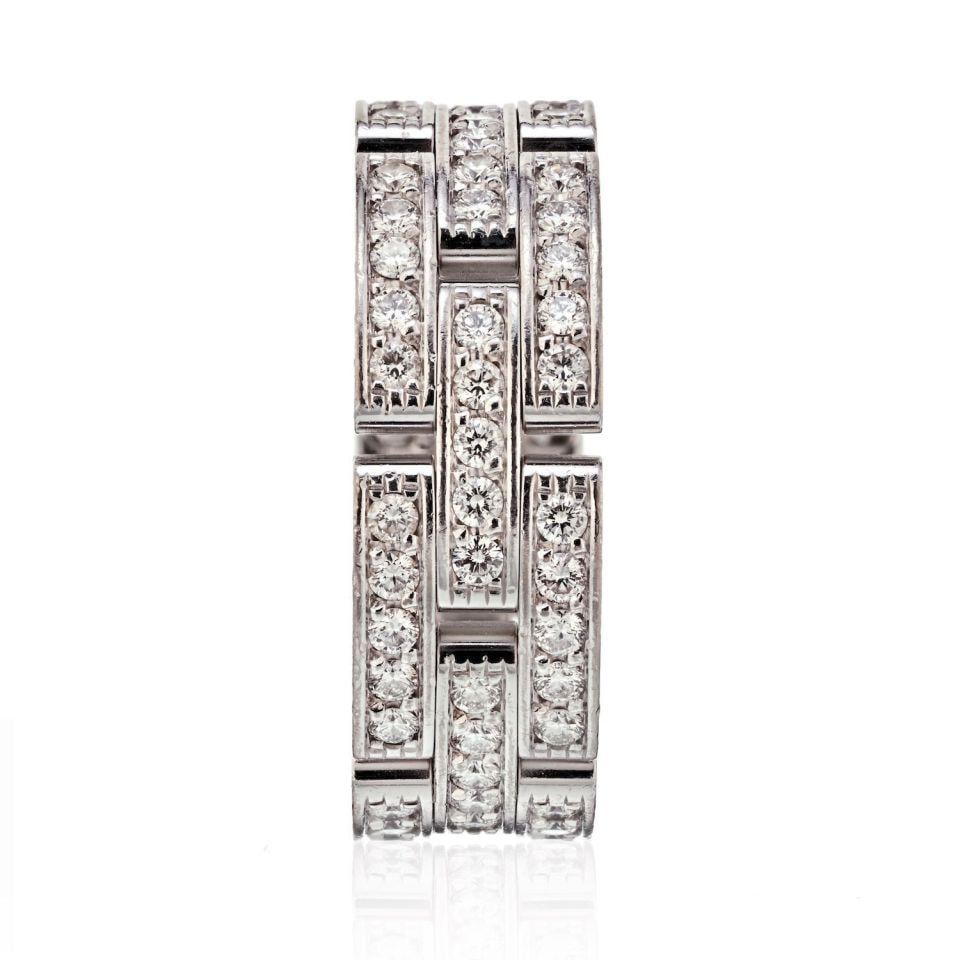 Three Row Diamond Maillon Panthere Band in 18K White Gold by Cartier: Three Row Diamond Maillon Panthere Band in 18K White Gold by Cartier This pre-owned Cartier Maillon Panthere ring is crafted from 18K white gold and features three rows of links inspired by Cartier's