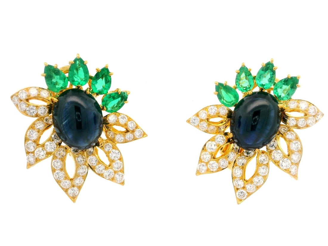 Omega 18k Gold GIA 16.53ctw Sapphire Emerald Diamond Earrings: Omega 18k Gold GIA 16.53ctw Sapphire Emerald Diamond Earrings These exquisite earrings showcase a stunning floral design crafted from solid 18k yellow gold. Featuring two natural genuine sapphires, ea
