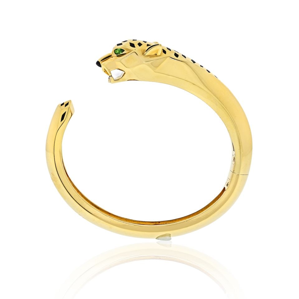 Cartier Panthere 18K Yellow Gold Cuff Bracelet with Panther Head Design: Cartier Panthere 18K Yellow Gold Cuff Bracelet with Panther Head Design Experience the exquisite craftsmanship of the Cartier Panthere Hinged Cuff Bracelet, a luxurious piece made from 18K yellow gold
