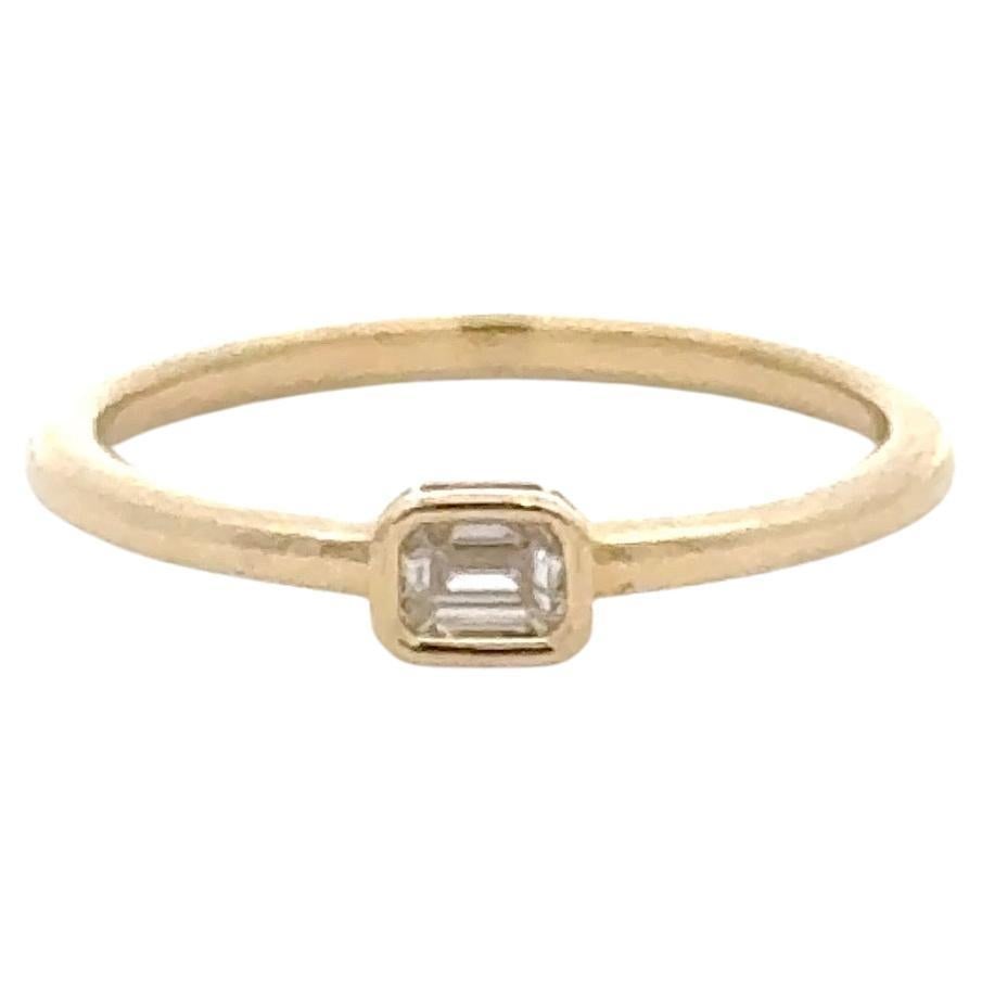 Harbor Diamonds 14K Yellow Gold Emerald Cut Diamond Stackable Ring 0.14ct: Harbor Diamonds 14K Yellow Gold Emerald Cut Diamond Stackable Ring 0.14ct This exquisite stackable ring features a stunning bezel set emerald cut diamond, weighing 0.14 carats, elegantly crafted in 14