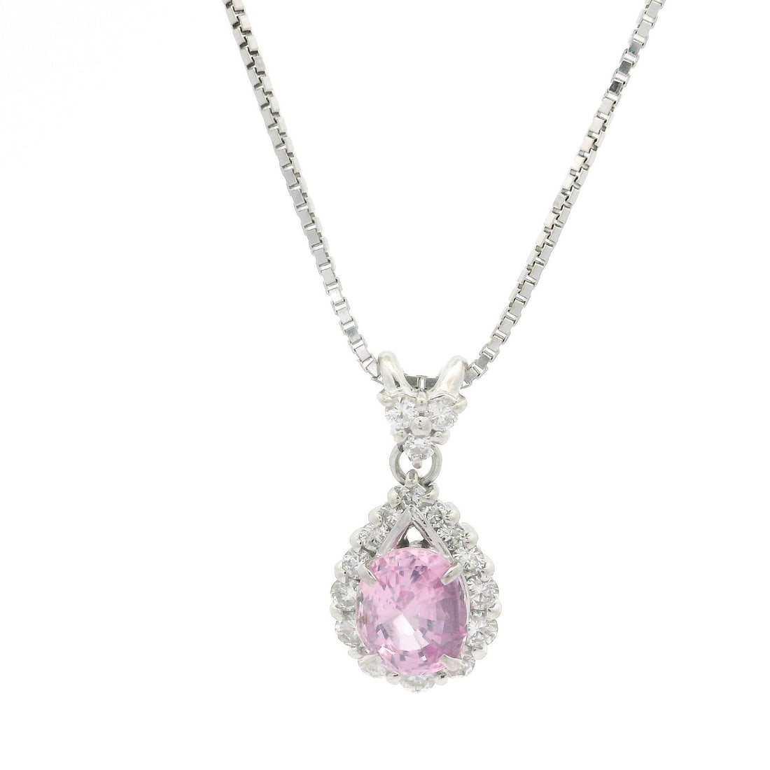 GIA Certified Pink Sapphire and Diamond Pendant in 18k White Gold and Platinum: GIA Certified Pink Sapphire and Diamond Pendant in 18k White Gold and Platinum This pendant necklace features a natural, no-heat pink sapphire from Ceylon certified by GIA, weighing 1.66 carats and cu