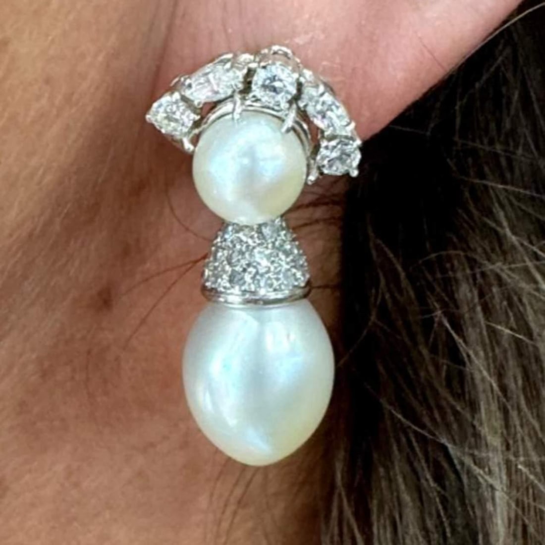Art Deco Platinum Diamond Earrings with South Sea Pearls: Art Deco Platinum Diamond Earrings with South Sea Pearls These stunning Art Deco earrings are crafted in luxurious platinum and adorned with approximately 100 diamonds totaling about 3.20 Ct., featuri