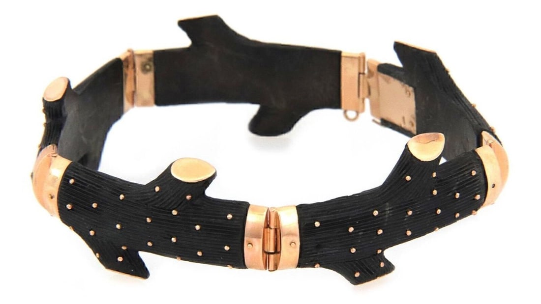 Dark Wood Tree Trunk Link Bracelet in 18k Rose Gold Lacquer Antique: Dark Wood Tree Trunk Link Bracelet in 18k Rose Gold Lacquer Antique This antique bracelet is crafted from 18k rose gold and features a striking lacquered dark wood tree trunk link design. Its vintage