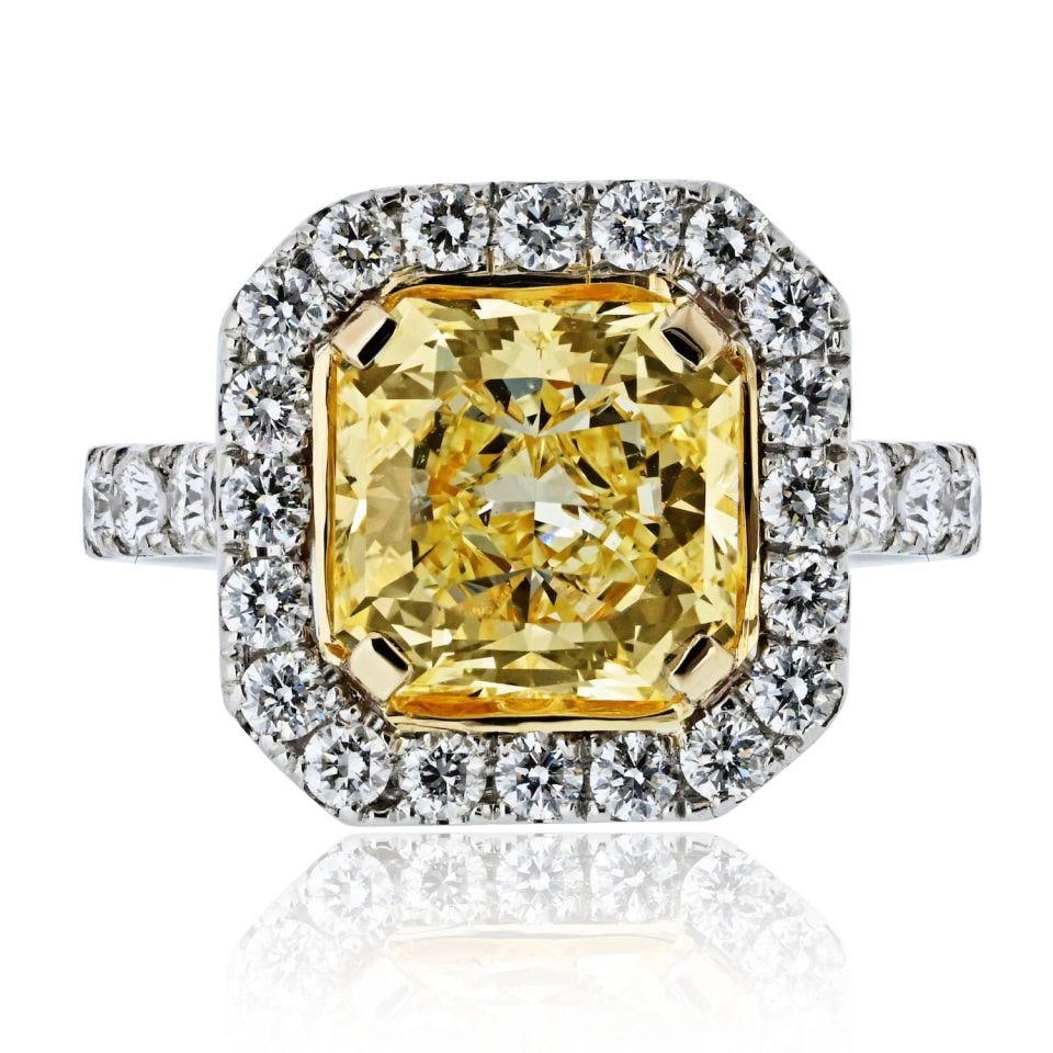 3.63 Carat GIA Fancy Yellow Radiant Cut Platinum Halo Engagement Ring: 3.63 Carat GIA Fancy Yellow Radiant Cut Platinum Halo Engagement Ring This stunning engagement ring features a captivating 3.63 carat fancy yellow radiant cut diamond at its center, boasting VS2 clari