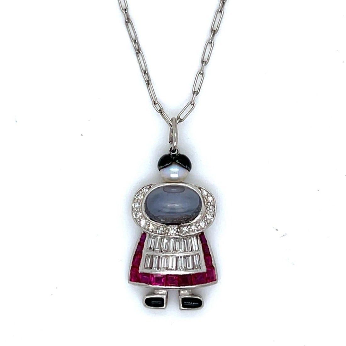 Art Deco Platinum Pendant Necklace with Natural Pearl Diamond Sapphire and Burma Ruby: Art Deco Platinum Pendant Necklace with Natural Pearl Diamond Sapphire and Burma Ruby This Art Deco pendant and chain feature an elegant combination of platinum, natural pearl, Burma rubies, star sapp
