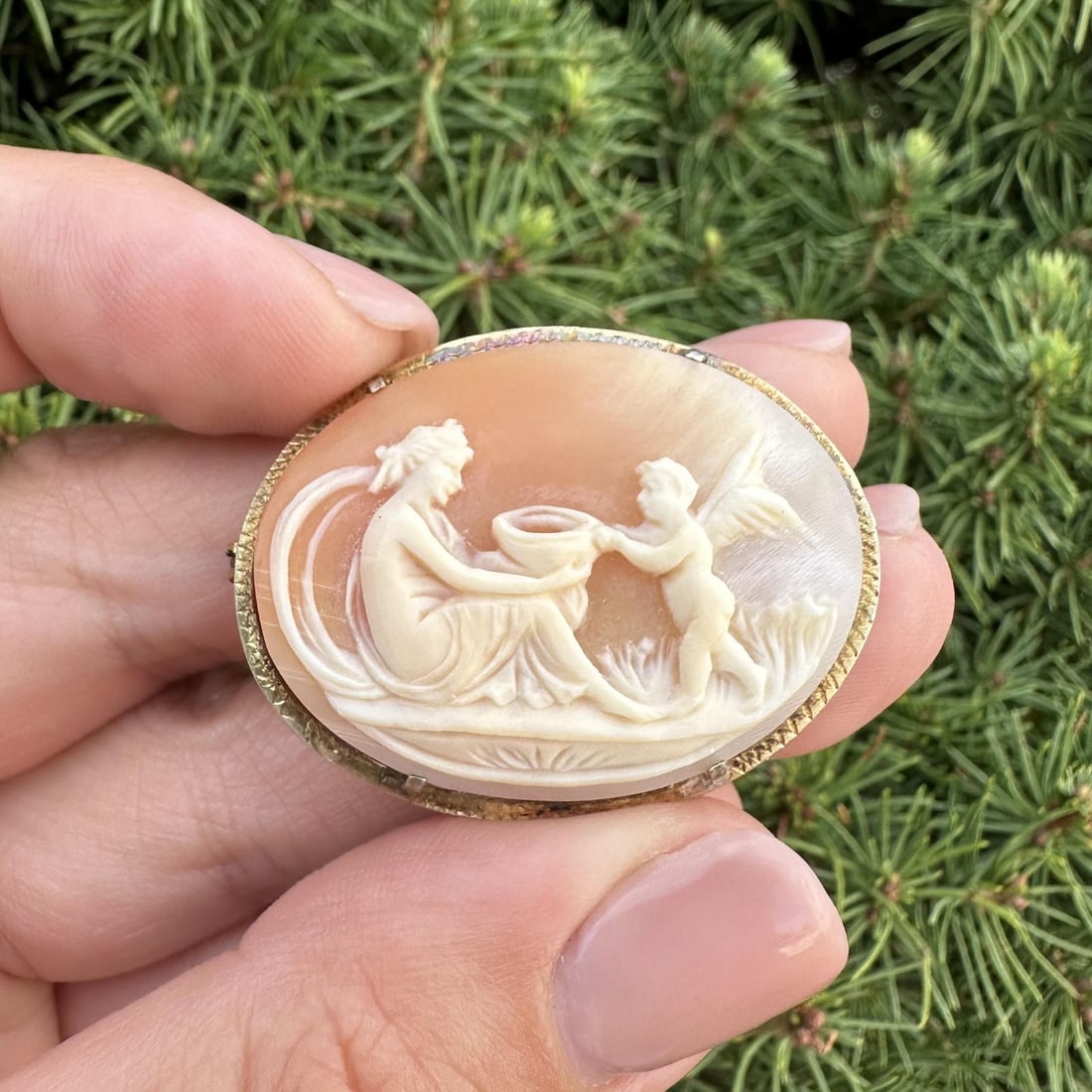 Vintage Sterling Silver Cameo Brooch Woman Cherub Shell Pin: Vintage Sterling Silver Cameo Brooch Woman Cherub Shell Pin This exquisite vintage brooch features a beautifully carved shell cameo depicting a woman and cherub. Crafted from sterling silver, this pie