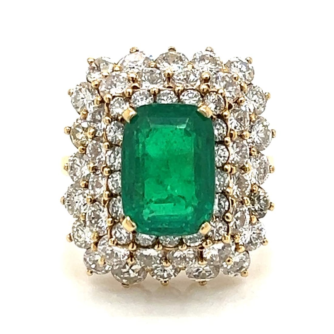 18K Yellow Gold Colombian Emerald Diamond Ring 3.25 Ct Emerald 3.00 Ct Diamonds: 18K Yellow Gold Colombian Emerald Diamond Ring 3.25 Ct Emerald 3.00 Ct Diamonds This exquisite 18K Yellow Gold Ring features a stunning arrangement of Colombian Emeralds and Diamonds. It showcases app
