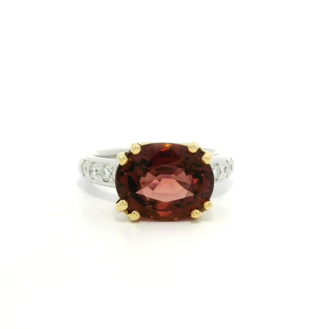 GIA Certified 4.67ct Pink Peachy Tourmaline Diamond Ring in Gold & Platinum: GIA Certified 4.67ct Pink Peachy Tourmaline Diamond Ring in Gold & Platinum This stunning cocktail ring features a natural genuine oval-cut tourmaline in a beautiful brownish pink hue, weighing 4.47 c