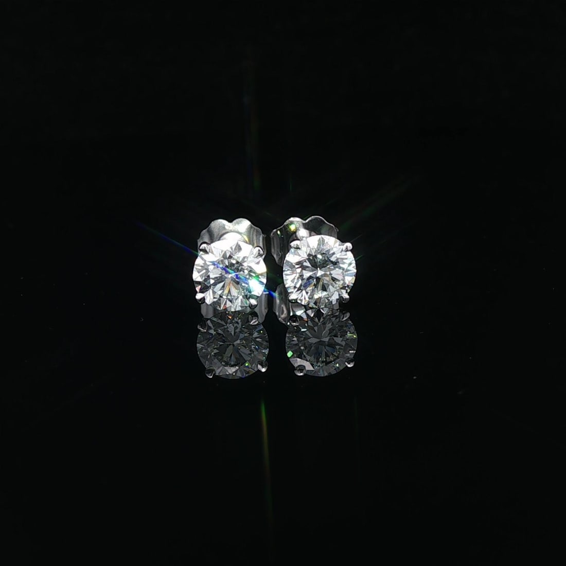 GIA Certified 1.60ctw G VVS2 Round Diamond Stud Earrings in Platinum Martini Setting: GIA Certified 1.60ctw G VVS2 Round Diamond Stud Earrings in Platinum Martini Setting These un-used platinum diamond stud earrings feature two natural round brilliant cut diamonds, each certified by GI