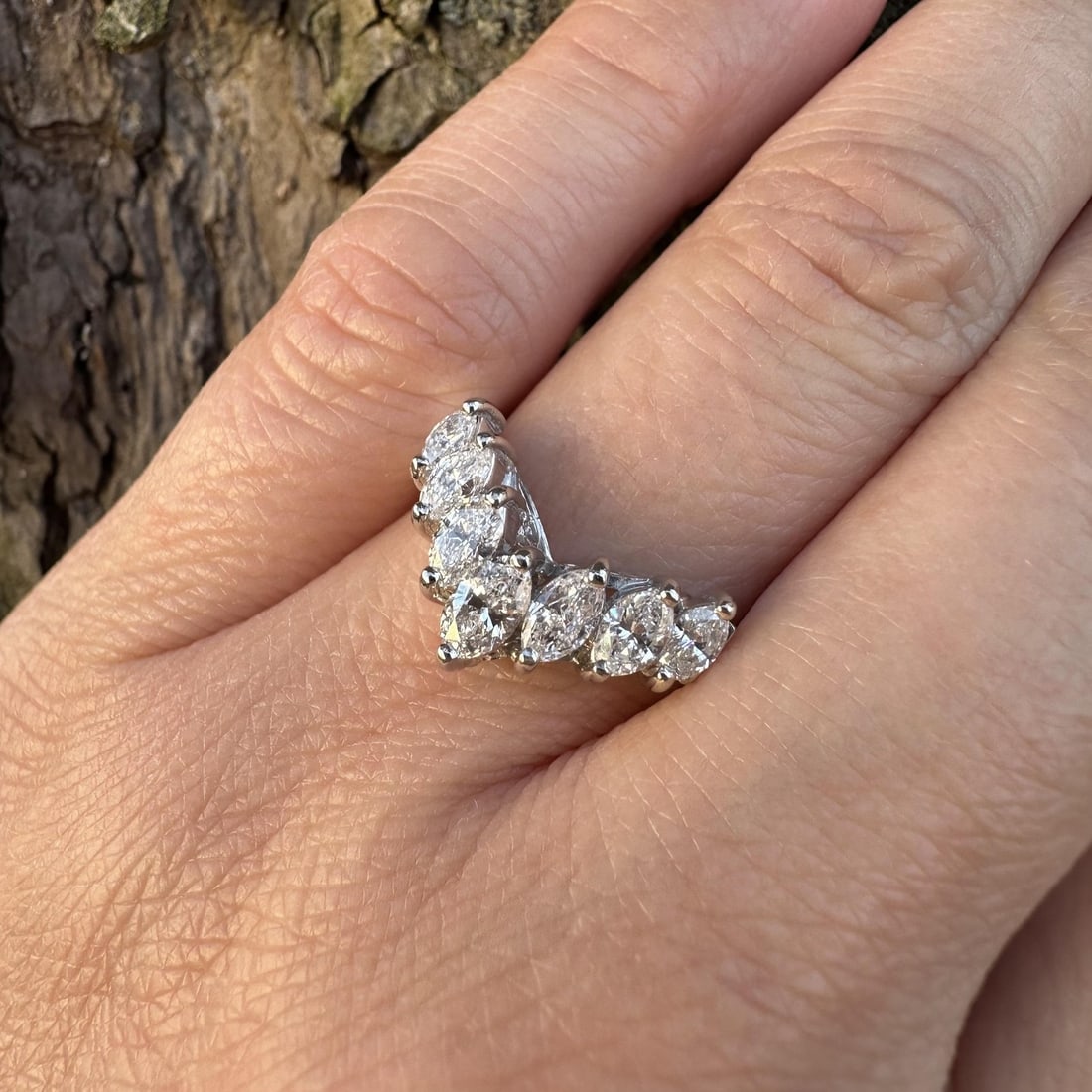 Platinum Chevron Band Ring with Seven Marquise Diamonds 1.03ctw Size 7: Platinum Chevron Band Ring with Seven Marquise Diamonds 1.03ctw Size 7 This platinum band ring features seven natural marquise cut diamonds set in a chevron "V" shape design. The diamonds have a total