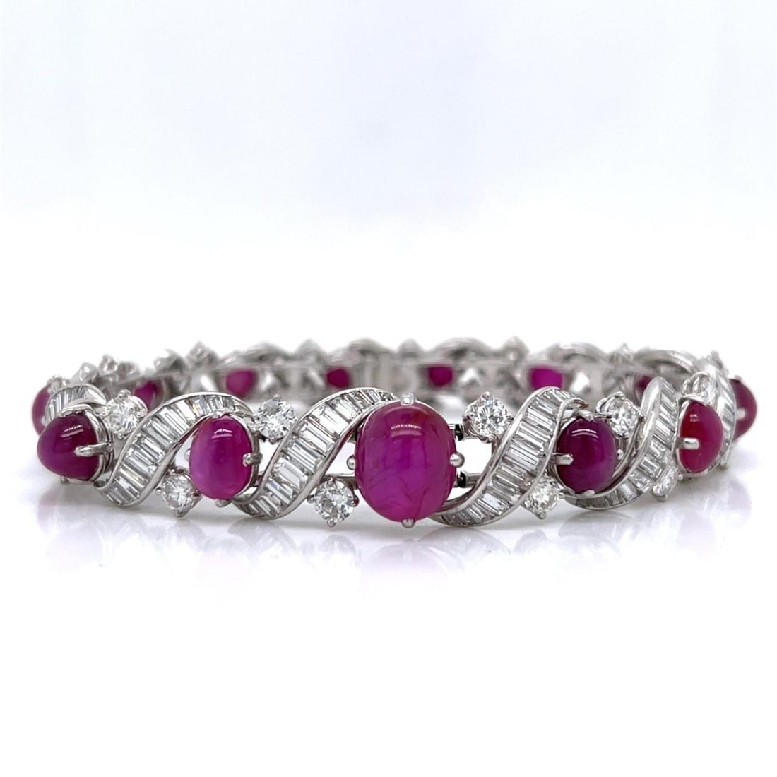 1950s Platinum GIA Certified No-heat Ruby Diamond Bracelet 30Ct Rubies 10Ct Diamonds: 1950s Platinum GIA Certified No-heat Ruby Diamond Bracelet 30Ct Rubies 10Ct Diamonds This exquisite 1950's bracelet is crafted in platinum and features a stunning arrangement of gemstones. It is adorn