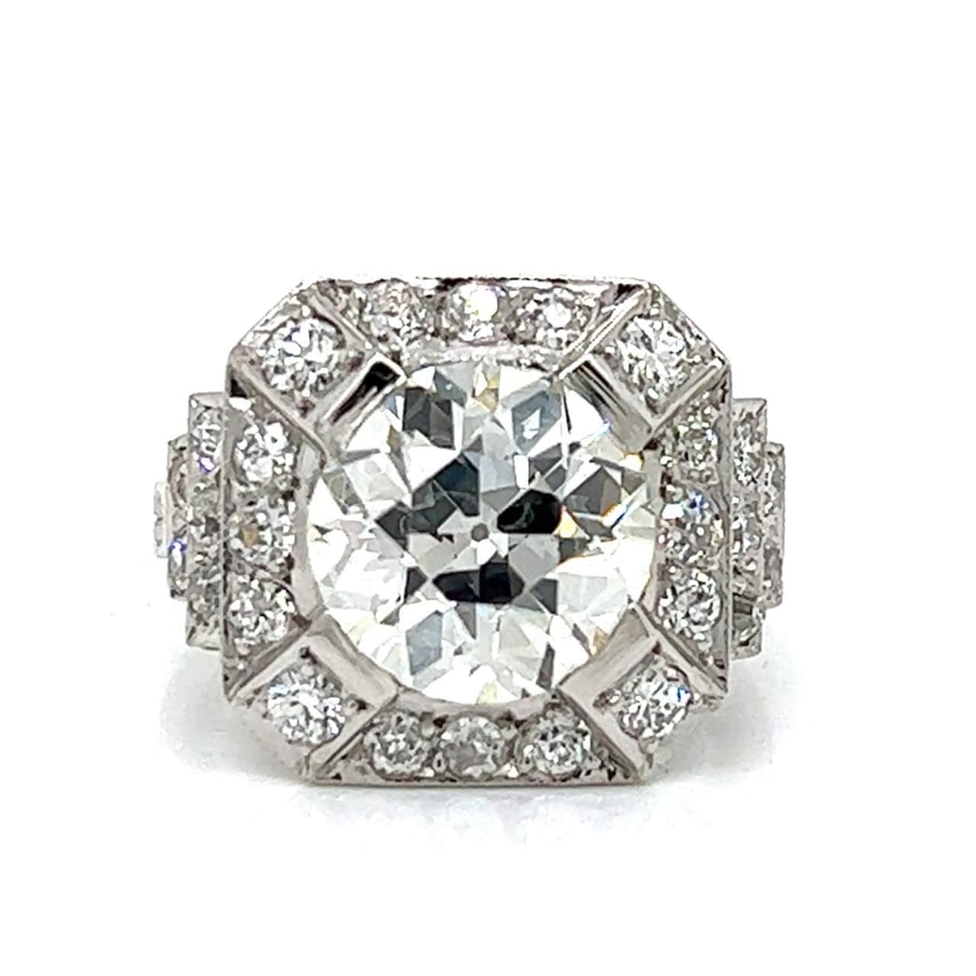 Platinum 4.18 Ct GIA Certified Old European Diamond Ring with 26 Accent Diamonds: Platinum 4.18 Ct GIA Certified Old European Diamond Ring with 26 Accent Diamonds This exquisite Platinum ring features a stunning GIA Certified Old European-cut diamond weighing 4.18 Ct. The diamond e