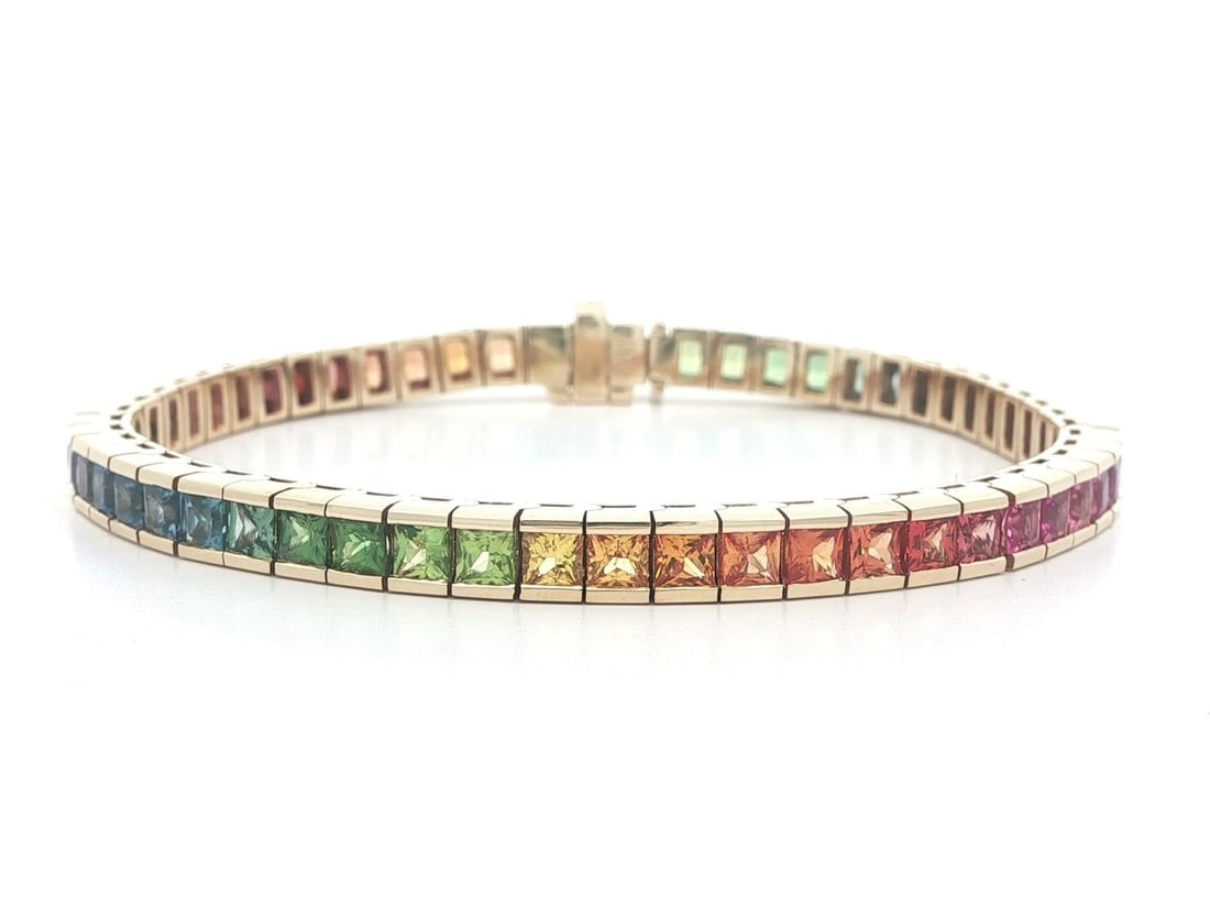 Natural Square Sapphire Tennis Bracelet 14k Yellow Gold Multicolor 11.35ct Gemstones: Natural Square Sapphire Tennis Bracelet 14k Yellow Gold Multicolor 11.35ct Gemstones This is a 14k yellow gold tennis bracelet featuring 56 natural square-cut sapphires in a vibrant rainbow of orange,
