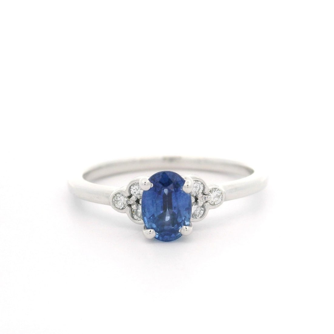 14k White Gold Oval Blue Sapphire Diamond Petite Promise Ring: 14k White Gold Oval Blue Sapphire Diamond Petite Promise Ring This exquisite petite promise ring features a stunning oval sapphire at its center, elegantly surrounded by six round brilliant cut diamon