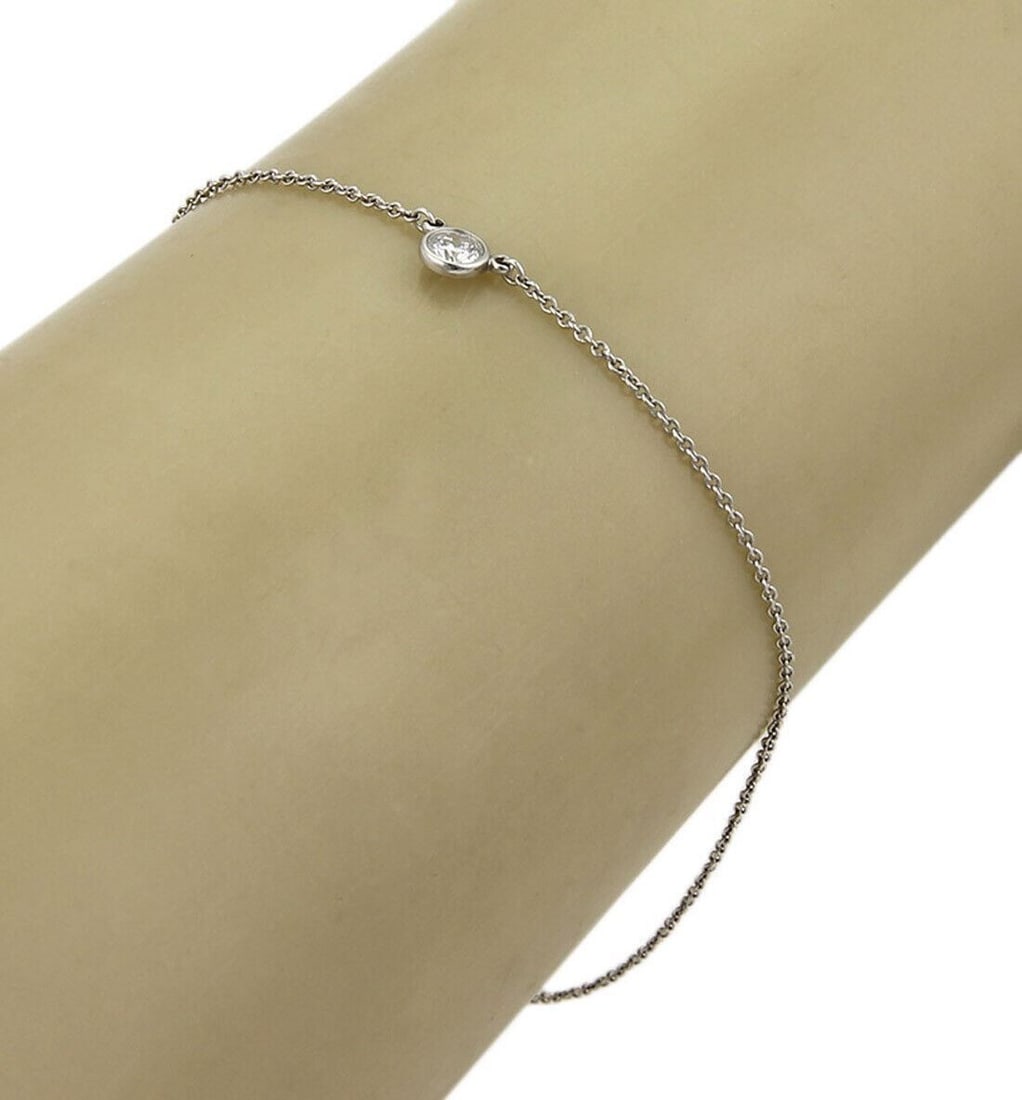 Peretti Diamond By The Yard Platinum 8.5 Inch Bracelet by Tiffany & Co.: Peretti Diamond By The Yard Platinum 8.5 Inch Bracelet by Tiffany & Co. This Tiffany & Co. Peretti Diamond By The Yard bracelet features a sleek platinum chain adorned with a 0.17ct diamond. Measuring