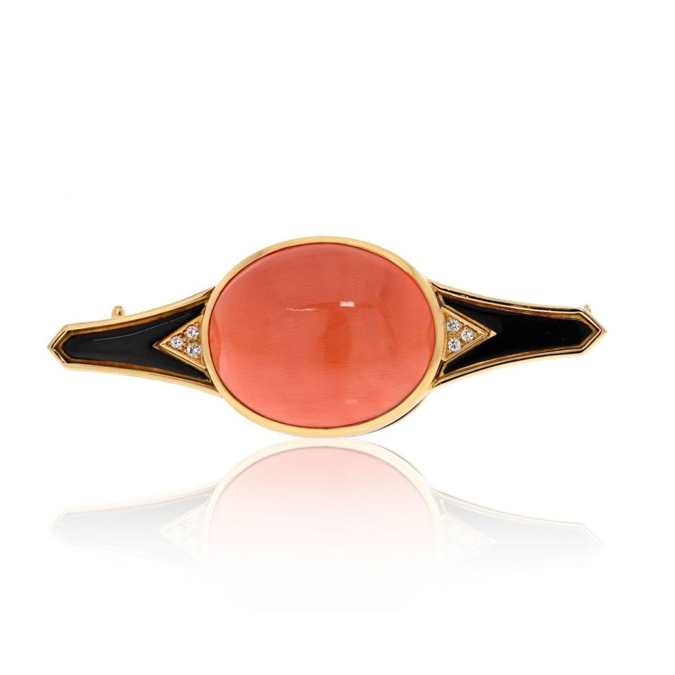 Bvlgari 18K Yellow Gold Coral Black Enamel Diamond Brooch 63mm: Bvlgari 18K Yellow Gold Coral Black Enamel Diamond Brooch 63mm This exquisite Bvlgari brooch showcases a stunning combination of 18K yellow gold, coral, black enamel, and diamonds. The brooch measures