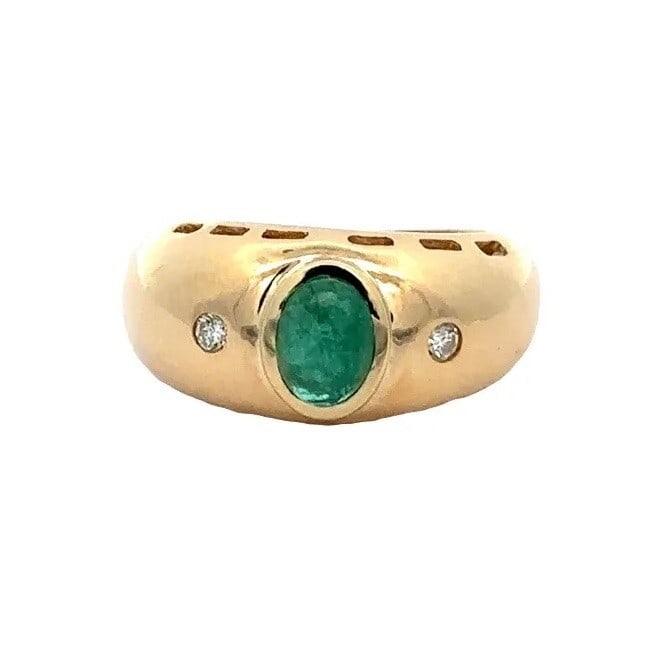 Vintage 18k Yellow Gold Emerald Diamond Accent Dome Ring: Vintage 18k Yellow Gold Emerald Diamond Accent Dome Ring This stunning vintage cocktail ring showcases a solid 18k yellow gold design, featuring an elegant oval cabochon emerald as its centerpiece. Th
