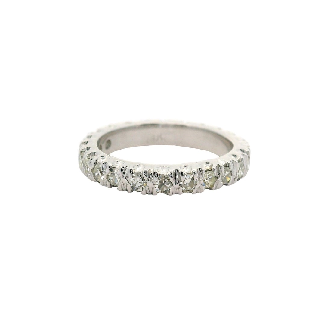Vintage 14k White Gold Floral Engraved Diamond Band Ring: Vintage 14k White Gold Floral Engraved Diamond Band Ring This exquisite vintage band ring features a stunning floral engraved design crafted from solid 14k white gold. It showcases a fishtail pave set