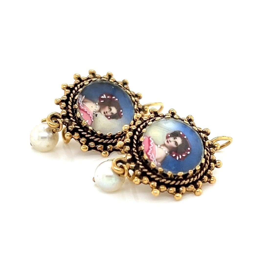 Vintage 14k Gold Dangle Earrings with Painted Cameo and Pearl Accents: Vintage 14k Gold Dangle Earrings with Painted Cameo and Pearl Accents These vintage dangle earrings feature painted cameo pendants and lustrous pearls set in 14k yellow gold. The earrings are crafted