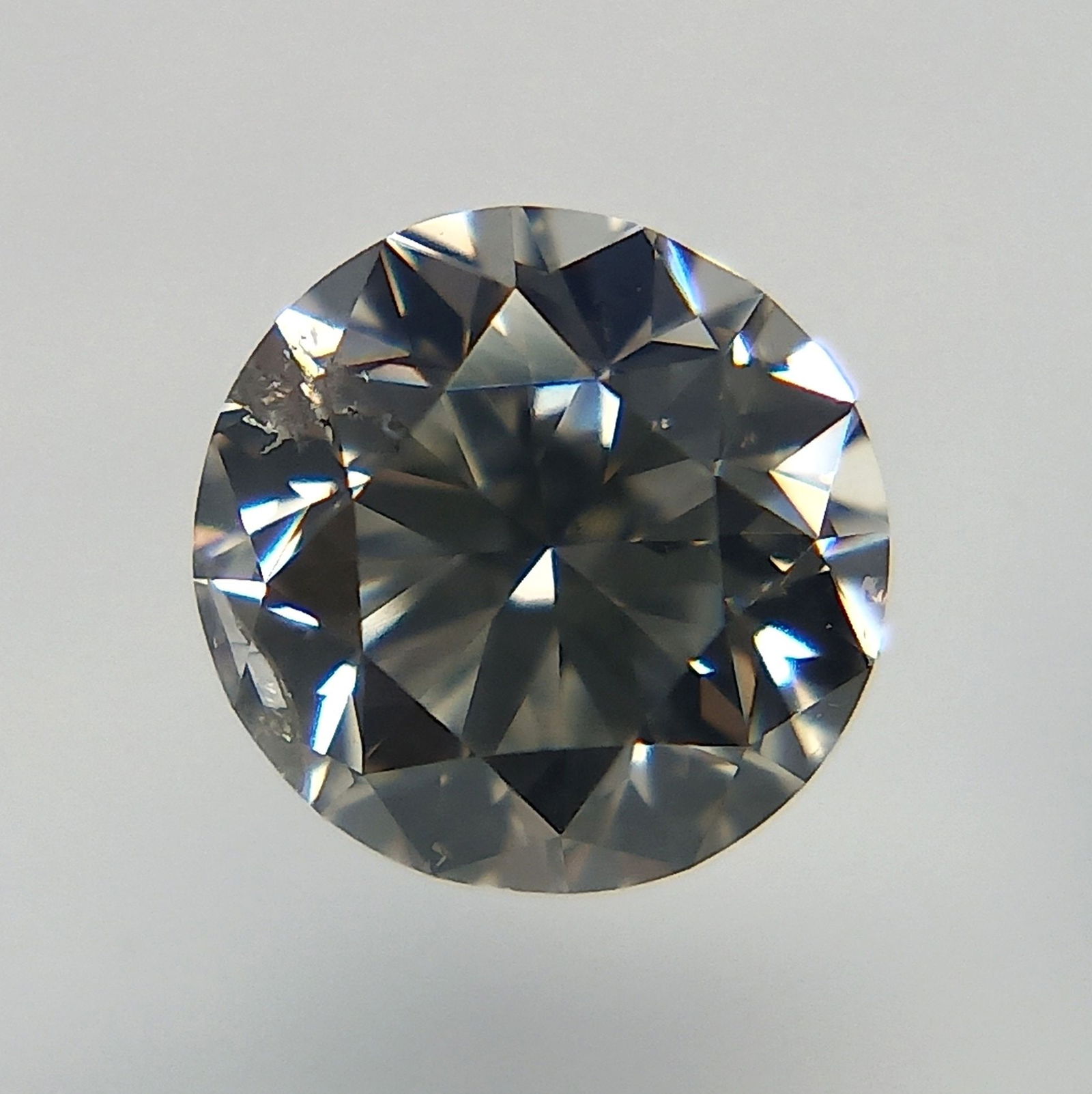 Loose Diamond - ROUND 0.4ct Fancy Light Gray SI2: Loose Diamond - ROUND 0.4ct Fancy Light Gray SI2 Source: Natural Shape: ROUND Carats: 0.4 Color: Fancy Light Gray Certification: GIA PLEASE NOTE: Framed, Large, or heavy items do not have shipping cos