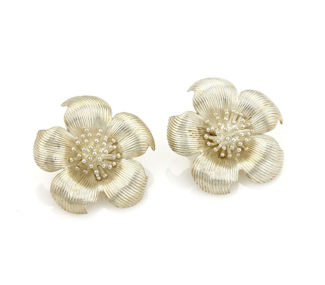 Sterling Silver Dogwood Flower Clip Earrings by Tiffany & Co Pair: Sterling Silver Dogwood Flower Clip Earrings by Tiffany & Co Pair These Tiffany & Co. large dogwood flower clip-on earrings are crafted from sterling silver and feature a bold, sculptural floral motif
