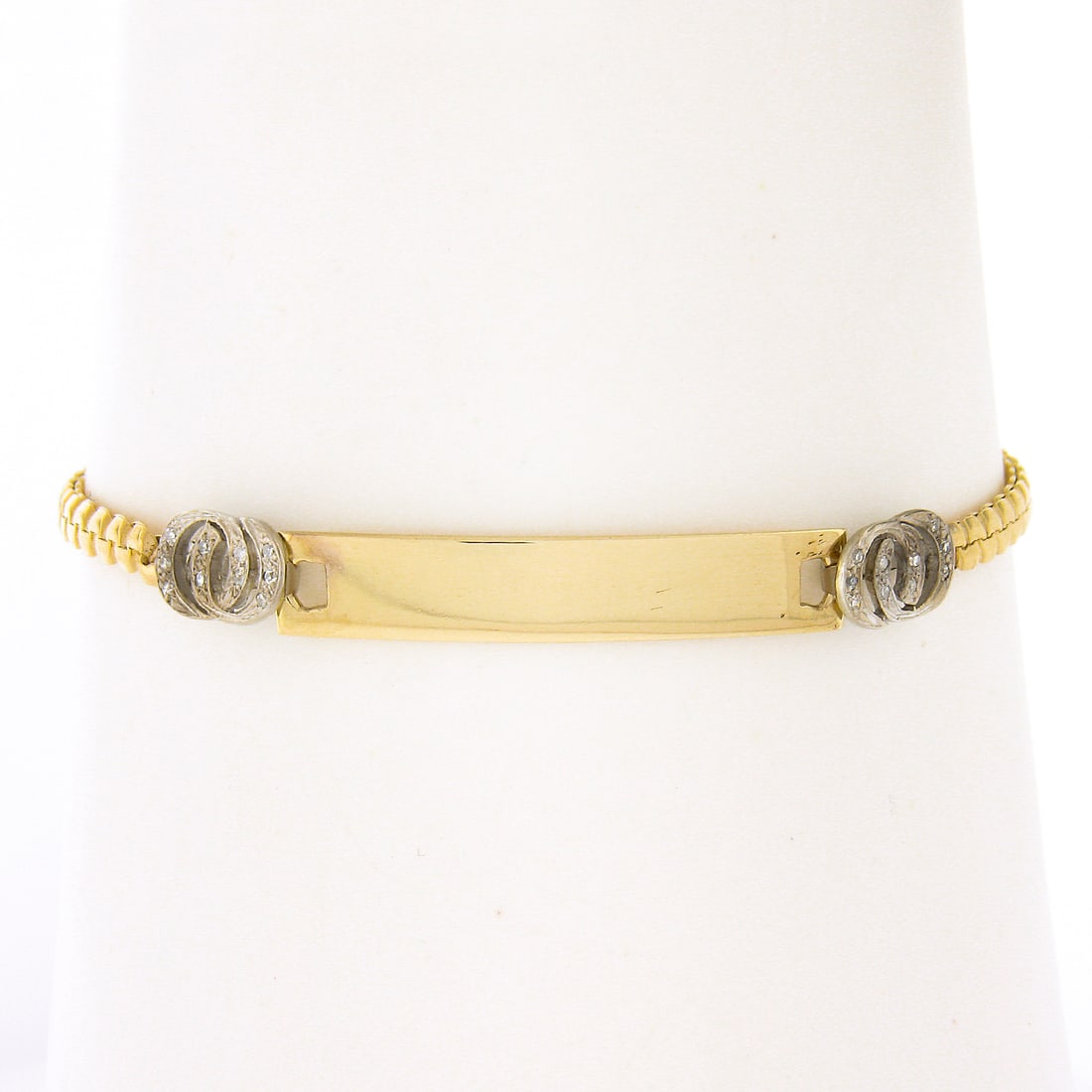 14k Yellow Gold 6.25" Engraveable ID Bracelet with Pave Diamond Circles: 14k Yellow Gold 6.25" Engraveable ID Bracelet with Pave Diamond Circles This exquisite 14k yellow gold ID chain bracelet features a length of 6.25 inches and is designed with elegant interlocking circ
