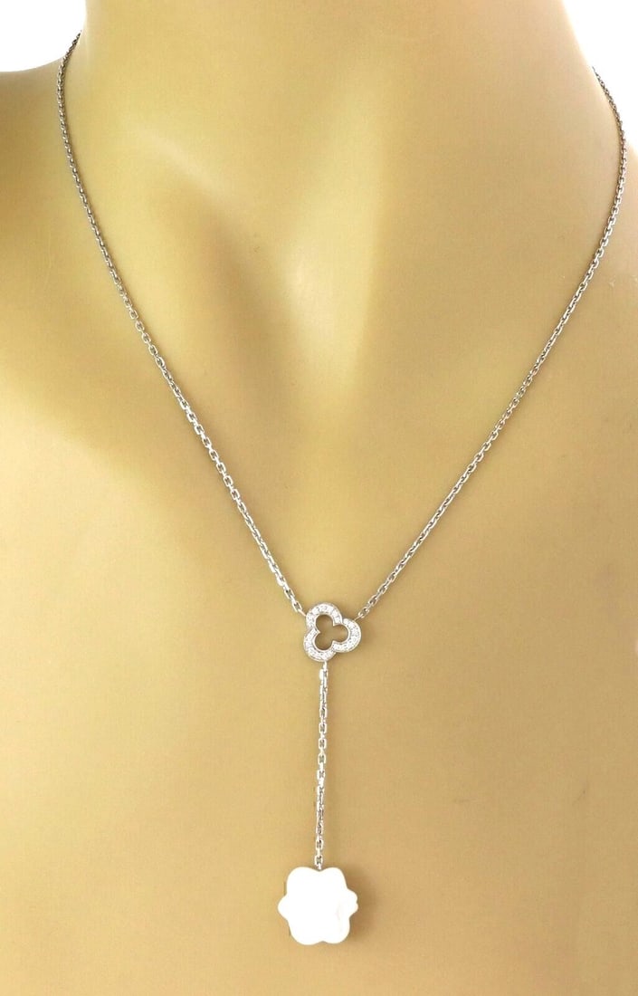 Chanel Camellia Lariat Necklace in 18k White Gold with Agate and Diamonds: Chanel Camellia Lariat Necklace in 18k White Gold with Agate and Diamonds This Chanel Camellia Lariat Necklace is crafted from 18k white gold and features a refined lariat design. Three white agate st