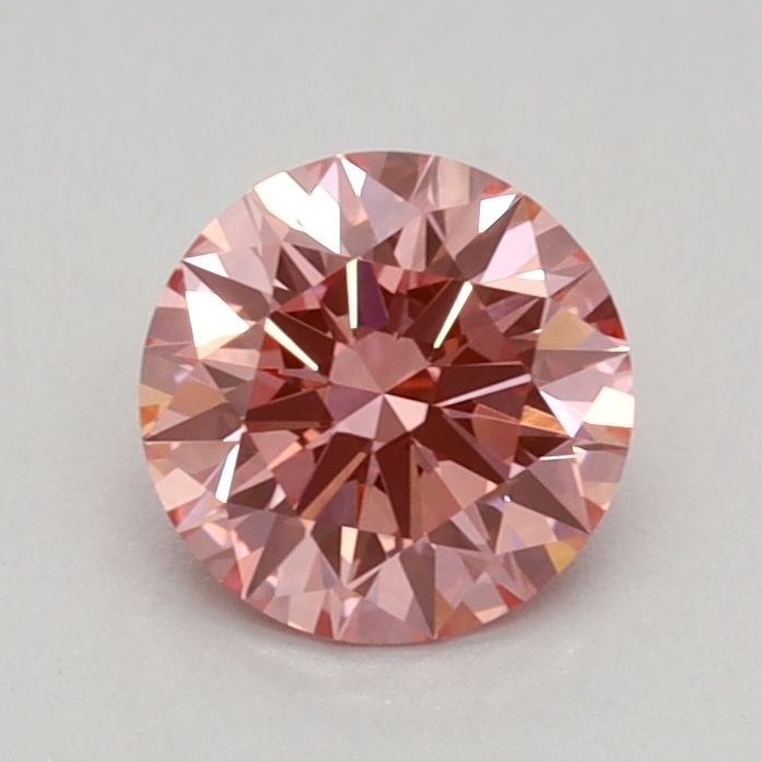 Ideal Loose Diamond - ROUND 0.58ct Fancy Vivid Pink VVS2: Ideal Loose Diamond - ROUND 0.58ct Fancy Vivid Pink VVS2 Source: This is a real non-mined Diamond that has been grown in a lab Shape: ROUND Carats: 0.58 Color: Fancy Vivid Pink Certification: IGI