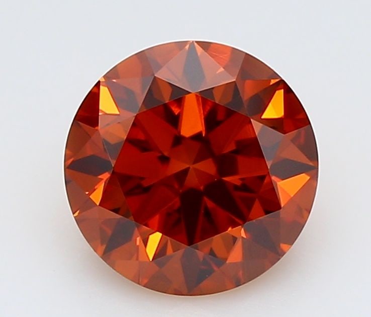 Ideal Loose Diamond - ROUND 0.94ct Fancy Vivid Orange VS1: Ideal Loose Diamond - ROUND 0.94ct Fancy Vivid Orange VS1 Source: This is a real non-mined Diamond that has been grown in a lab Shape: ROUND Carats: 0.94 Color: Fancy Vivid Orange Certification: IGI