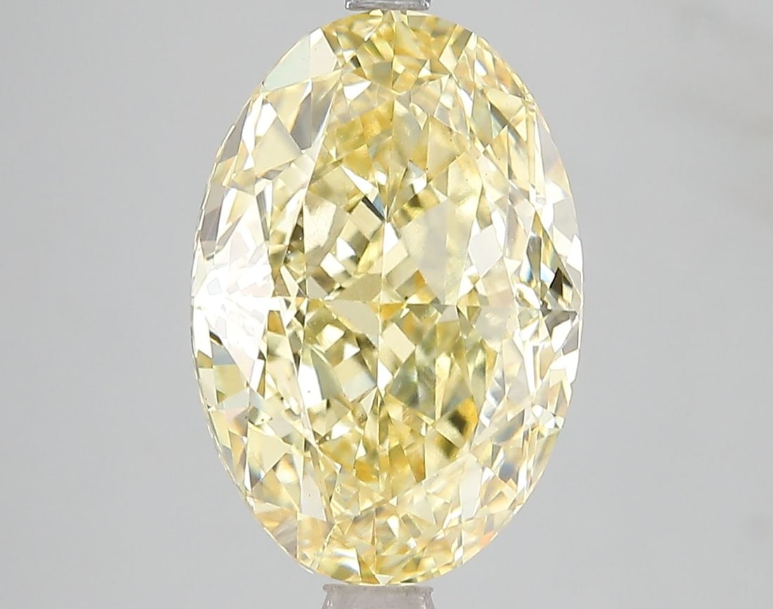 Loose Diamond - OVAL 6.02ct Fancy Vivid Yellow VS2: Loose Diamond - OVAL 6.02ct Fancy Vivid Yellow VS2 Source: This is a real non-mined Diamond that has been grown in a lab Shape: OVAL Carats: 6.02 Color: Fancy Vivid Yellow Certification: IGI Video: