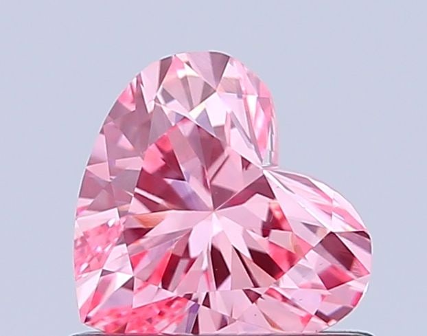 Loose Diamond - HEART 0.65ct Fancy Vivid Pink VS2: Loose Diamond - HEART 0.65ct Fancy Vivid Pink VS2 Source: This is a real non-mined Diamond that has been grown in a lab Shape: HEART Carats: 0.65 Color: Fancy Vivid Pink Certification: IGI Video: