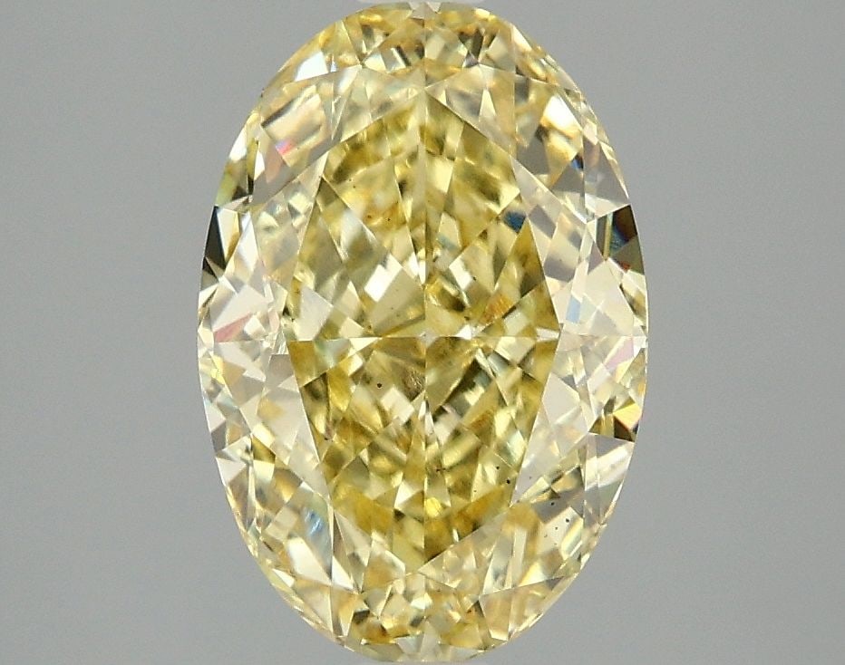 Loose Diamond - OVAL 3.04ct Fancy Vivid Yellow VS2: Loose Diamond - OVAL 3.04ct Fancy Vivid Yellow VS2 Source: This is a real non-mined Diamond that has been grown in a lab Shape: OVAL Carats: 3.04 Color: Fancy Vivid Yellow Certification: IGI Video:
