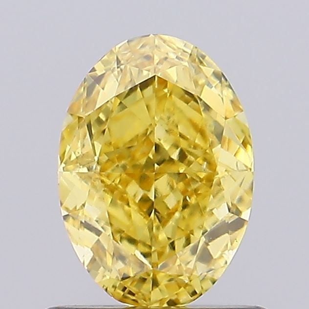 Loose Diamond - OVAL 0.9ct Fancy Vivid Yellow VS2: Loose Diamond - OVAL 0.9ct Fancy Vivid Yellow VS2 Source: This is a real non-mined Diamond that has been grown in a lab Shape: OVAL Carats: 0.9 Color: Fancy Vivid Yellow Certification: IGI Video: