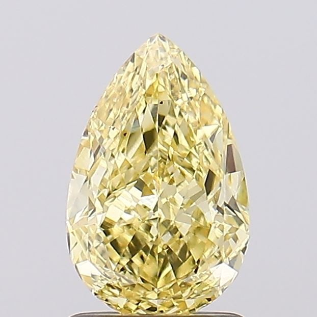 Loose Diamond - PEAR 1.47ct Fancy Vivid Yellow VS1: Loose Diamond - PEAR 1.47ct Fancy Vivid Yellow VS1 Source: This is a real non-mined Diamond that has been grown in a lab Shape: PEAR Carats: 1.47 Color: Fancy Vivid Yellow Certification: IGI Video: