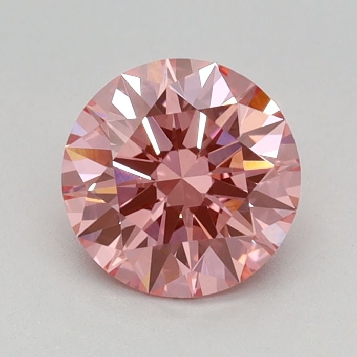 Ideal Loose Diamond - ROUND 0.64ct Fancy Vivid Pink VVS2: Ideal Loose Diamond - ROUND 0.64ct Fancy Vivid Pink VVS2 Source: This is a real non-mined Diamond that has been grown in a lab Shape: ROUND Carats: 0.64 Color: Fancy Vivid Pink Certification: IGI
