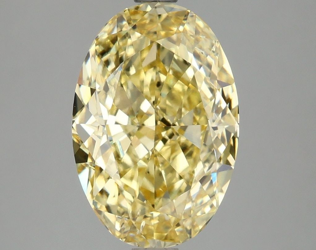 Loose Diamond - OVAL 4.1ct Fancy Vivid Yellow SI1: Loose Diamond - OVAL 4.1ct Fancy Vivid Yellow SI1 Source: This is a real non-mined Diamond that has been grown in a lab Shape: OVAL Carats: 4.1 Color: Fancy Vivid Yellow Certification: IGI Video: