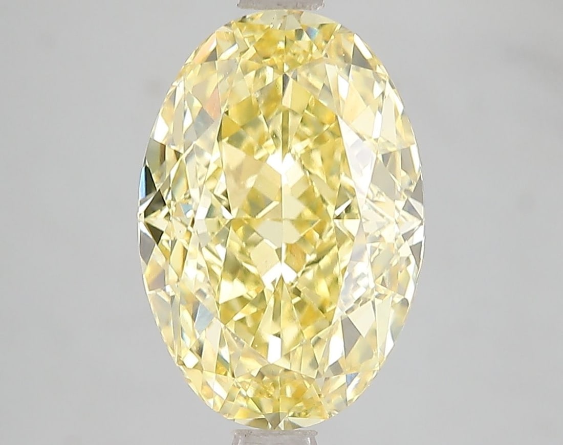 Loose Diamond - OVAL 5.2ct Fancy Vivid Yellow VS1: Loose Diamond - OVAL 5.2ct Fancy Vivid Yellow VS1 Source: This is a real non-mined Diamond that has been grown in a lab Shape: OVAL Carats: 5.2 Color: Fancy Vivid Yellow Certification: IGI Video: