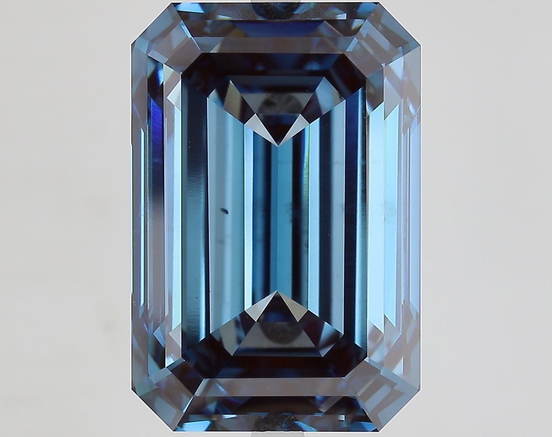 Loose Diamond - EMERALD 18.14ct Fancy Vivid Blue VS1: Loose Diamond - EMERALD 18.14ct Fancy Vivid Blue VS1 Source: This is a real non-mined Diamond that has been grown in a lab Shape: EMERALD Carats: 18.14 Color: Fancy Vivid Blue Certification: IGI Video