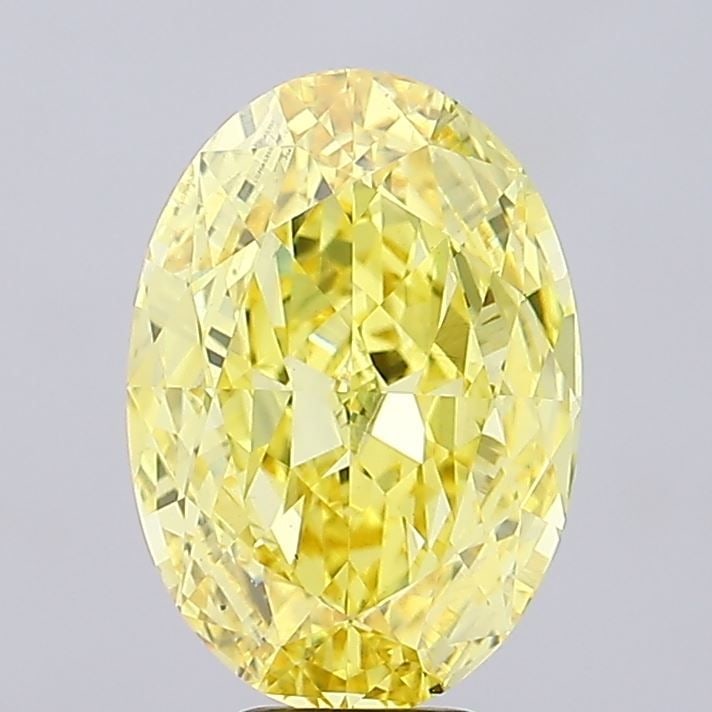 Loose Diamond - OVAL 7.04ct Fancy Vivid Yellow VS2: Loose Diamond - OVAL 7.04ct Fancy Vivid Yellow VS2 Source: This is a real non-mined Diamond that has been grown in a lab Shape: OVAL Carats: 7.04 Color: Fancy Vivid Yellow Certification: IGI Video: