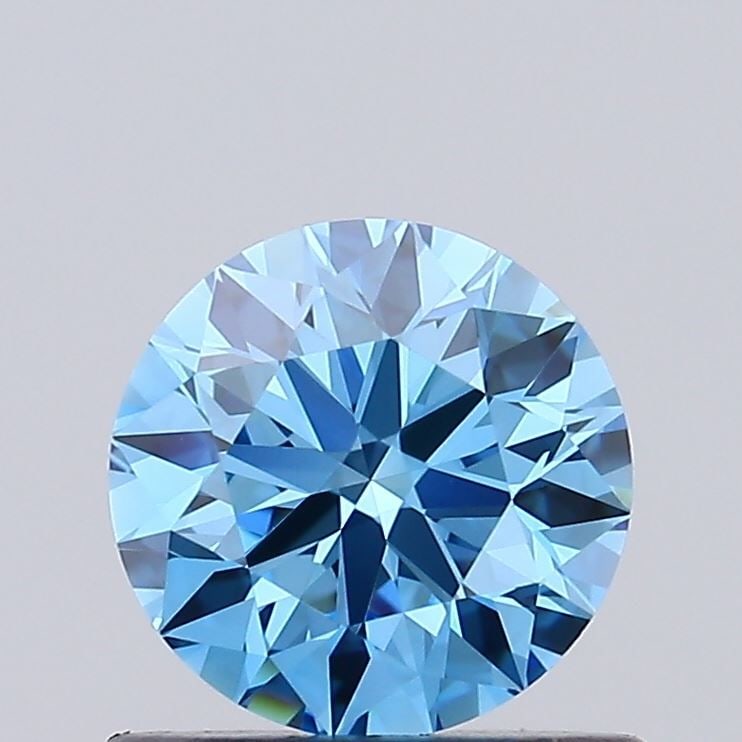 Ideal Loose Diamond - ROUND 0.73ct Fancy Vivid Blue VVS2: Ideal Loose Diamond - ROUND 0.73ct Fancy Vivid Blue VVS2 Source: This is a real non-mined Diamond that has been grown in a lab Shape: ROUND Carats: 0.73 Color: Fancy Vivid Blue Certification: IGI