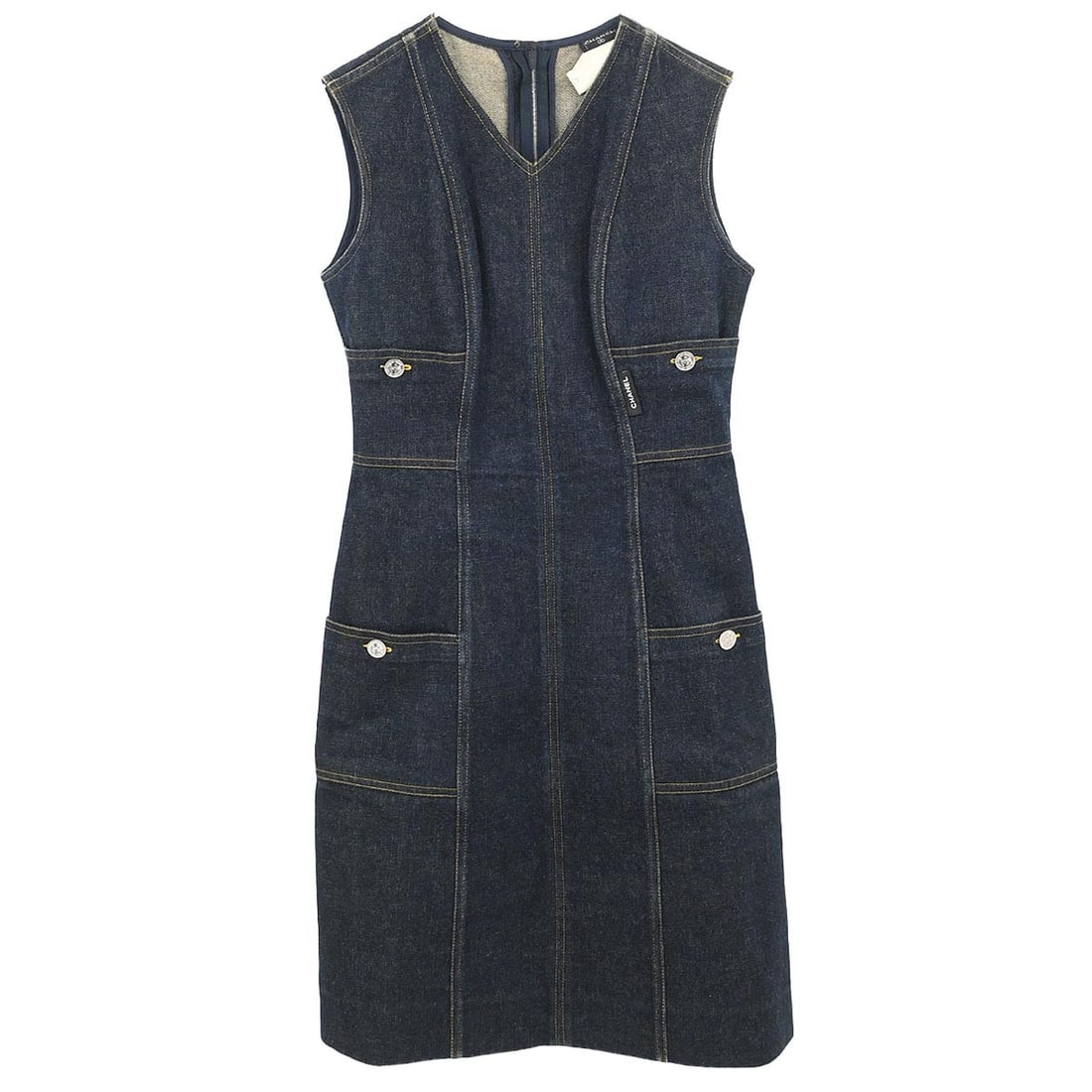 Navy Sleeveless Denim Knee Dress by Chanel Size FR 38: Navy Sleeveless Denim Knee Dress by Chanel Size FR 38 This Chanel sleeveless denim dress features a button closure and knee-length silhouette, designed in navy 100% cotton denim. It displays the iconi
